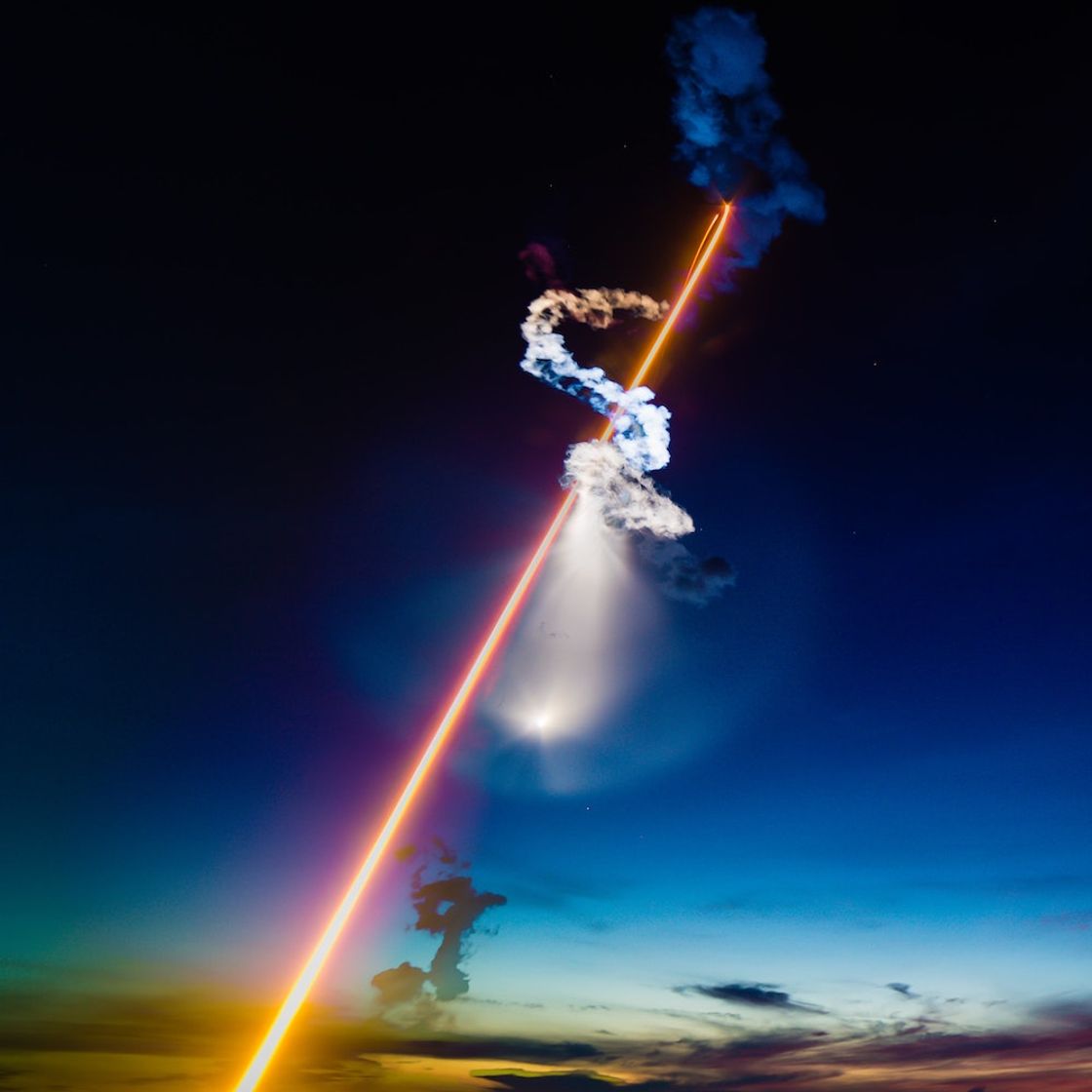 A rocket launching into space at fast speeds