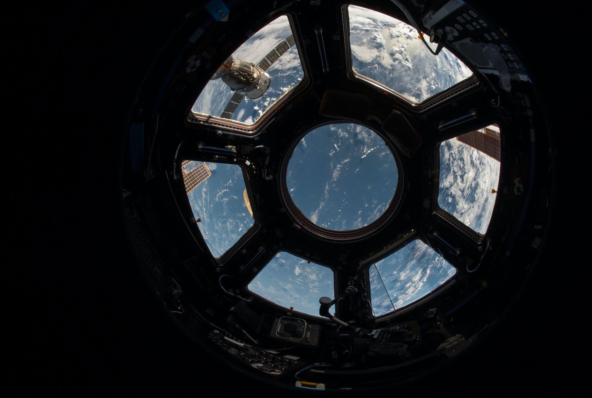 A view of earth, looking out of a spacestation window